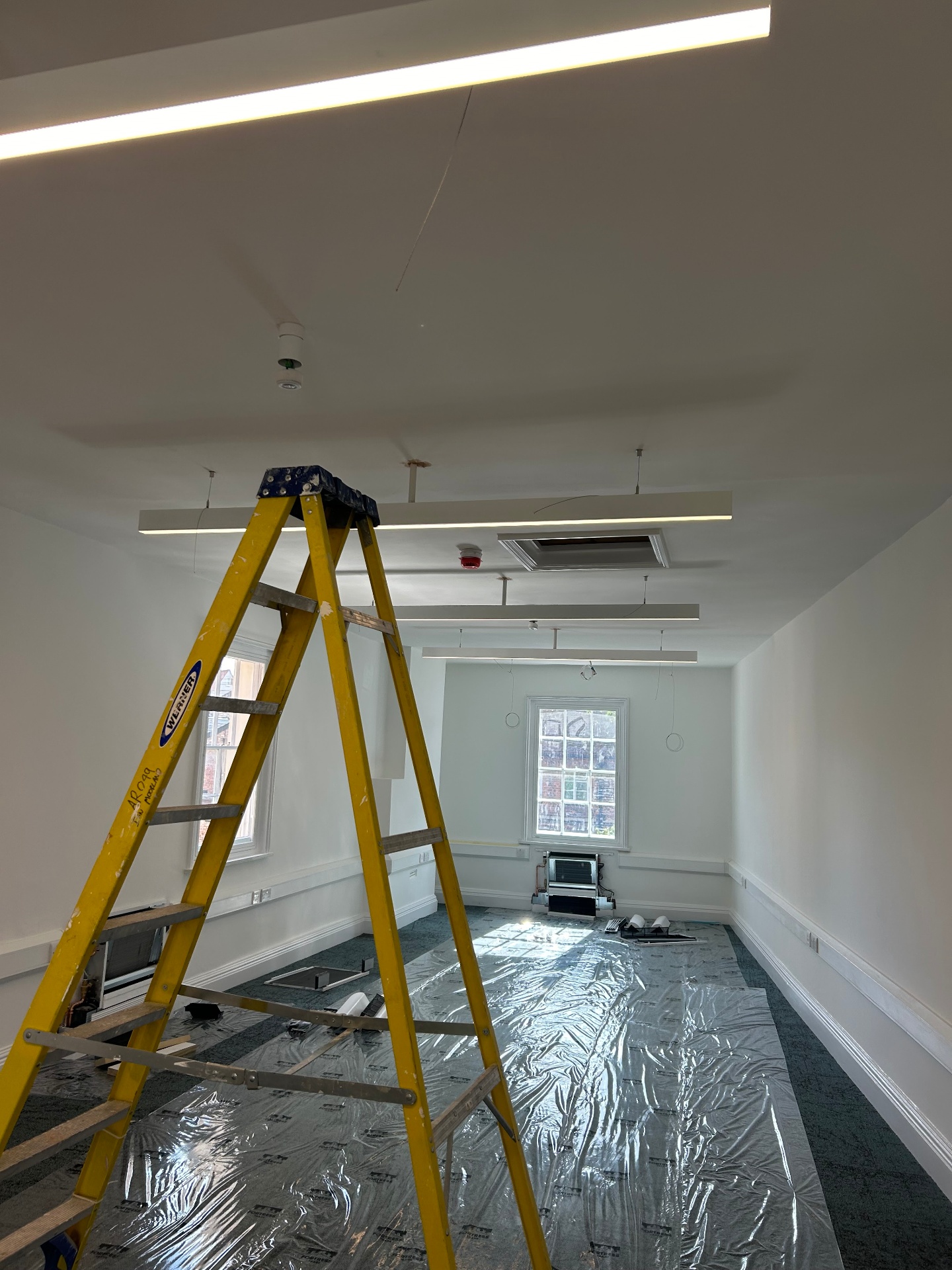 First fix rewiring in progress with fire alarm and ceiling cabling in Surrey