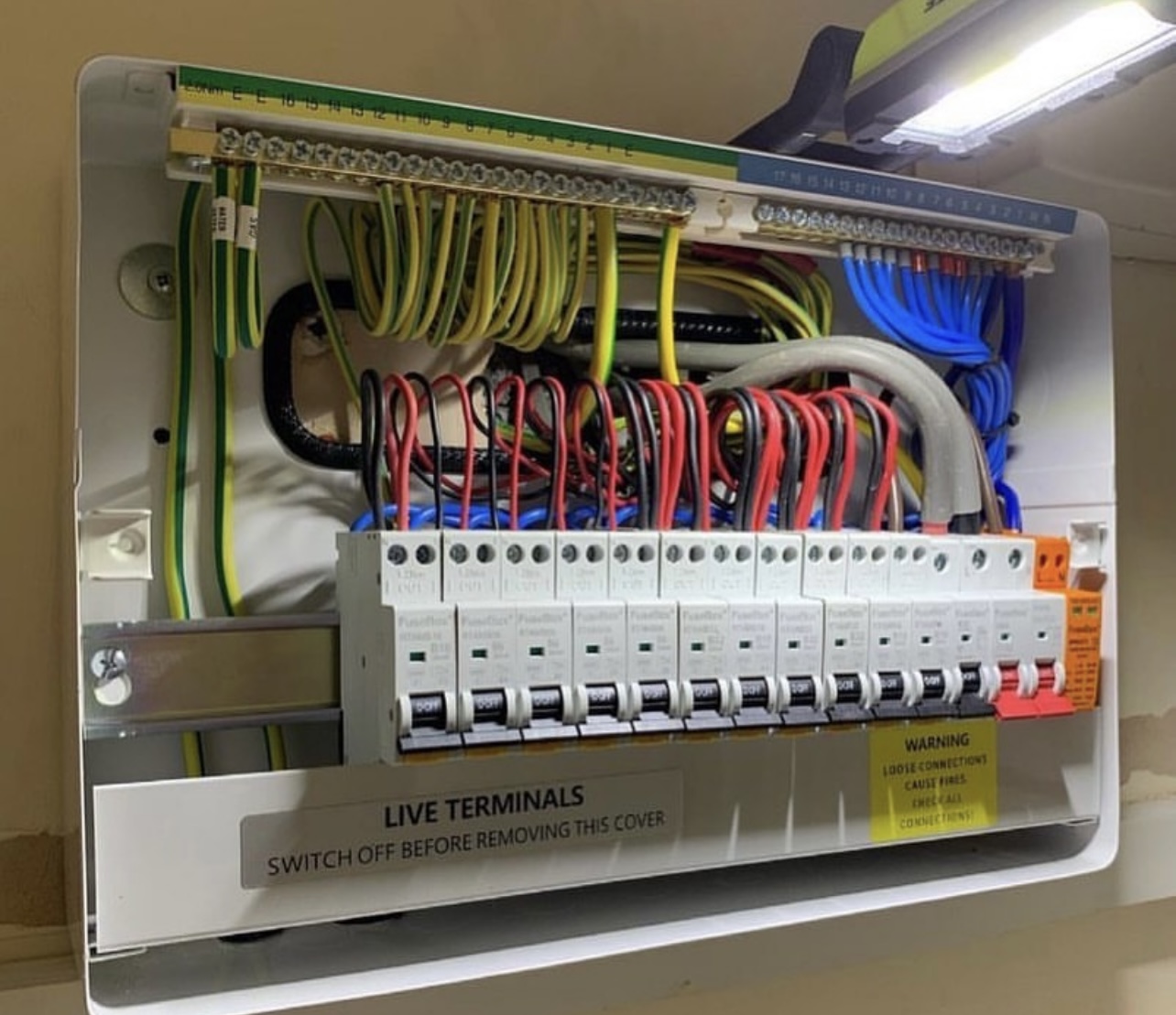 Consumer unit wiring with neatly routed cables and MCBs by LJK Electrical