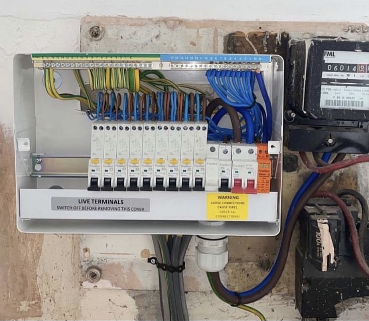 Modern consumer unit with circuit breakers installed in a Surrey home